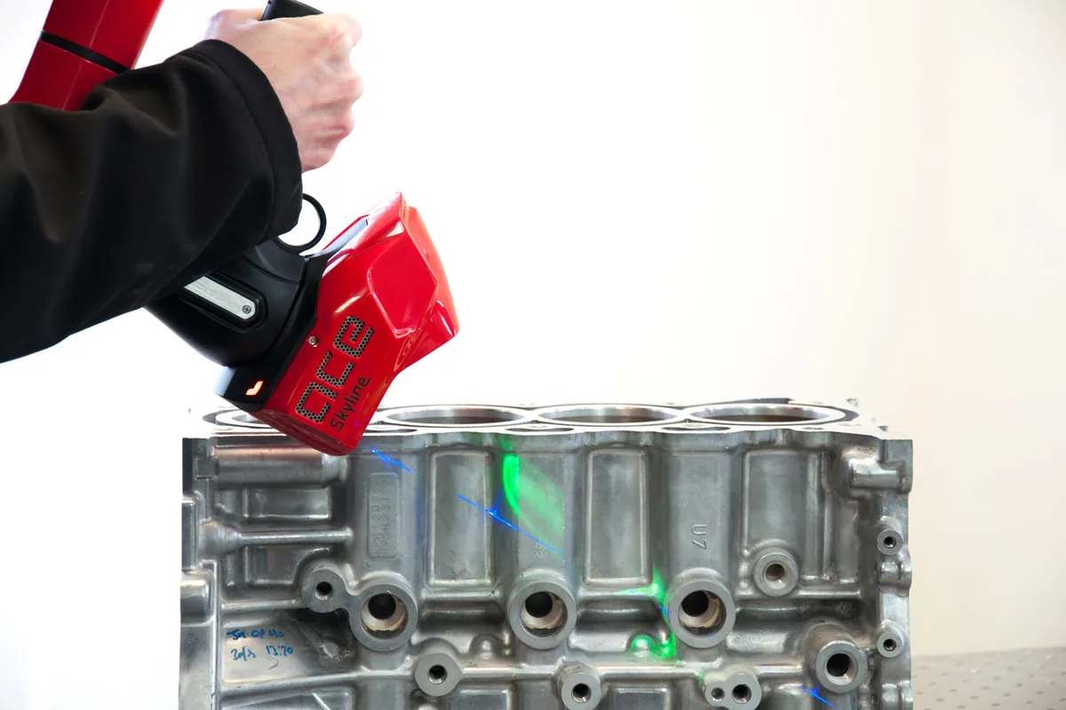 Engine block being scanned in situ with a measuring arm